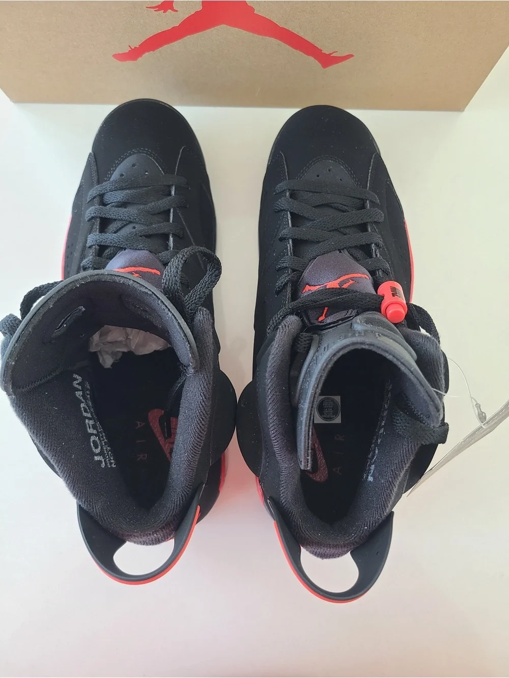 Jordan Kids Black Sneakers with Red Pull Tabs and Multicolor Tongue
